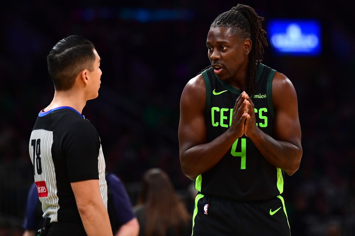 Dec 31, 2024; Boston, Massachusetts, USA;  Boston Celtics guard Jrue Holiday (4) questions a call with referee Evan Scott during the second half against the Toronto Raptors at TD Garden. Mandatory Credit: Bob DeChiara-Imagn Images