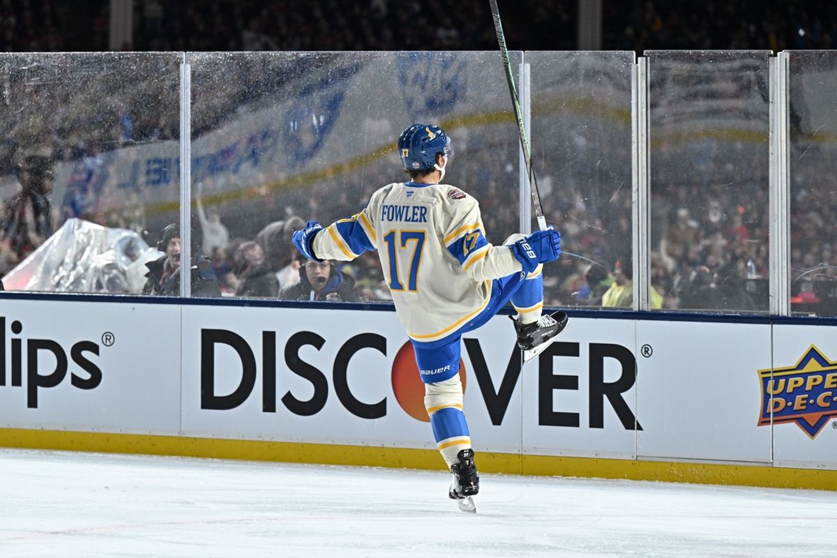 Dec 31, 2024; Chicago, Illinois, USA; St. Louis Blues defenseman Cam Fowler (17) celebrates after his goal against the Chicago Blackhawks during the first period in the Winter Classic at Wrigley Field. Mandatory Credit: Daniel Bartel-Imagn Images