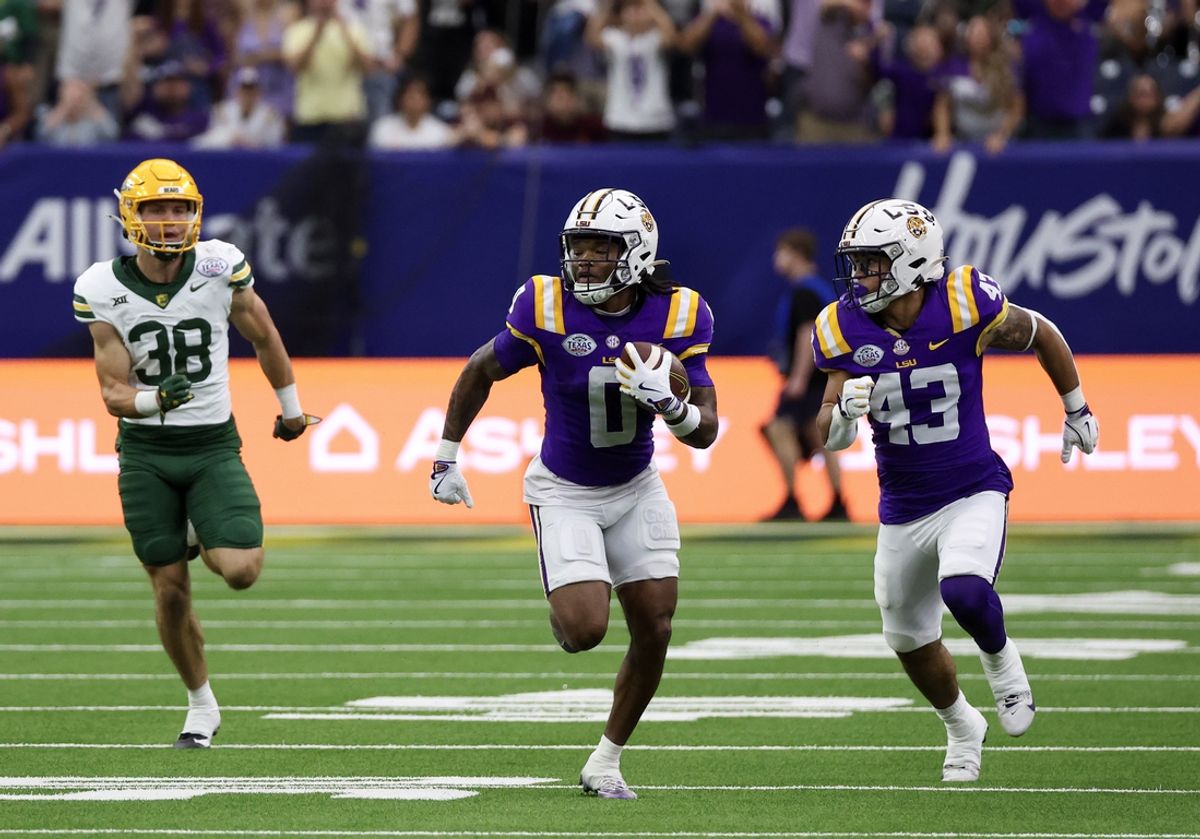 Dec 31, 2024; Houston, TX, USA; LSU Tigers special teams  Zavion Thomas (0) returns a kick off for a touchdown against the Baylor Bears in the second quarter at NRG Stadium. Mandatory Credit: Thomas Shea-Imagn Images