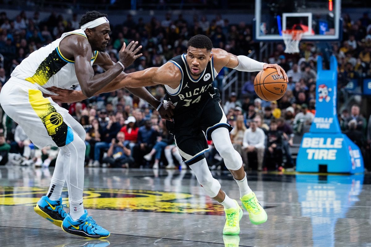 Dec 31, 2024; Indianapolis, Indiana, USA; Milwaukee Bucks forward Giannis Antetokounmpo (34) dribbles  the ball while Indiana Pacers forward Pascal Siakam (43) defends in the second half at Gainbridge Fieldhouse. Mandatory Credit: Trevor Ruszkowski-Imagn Images