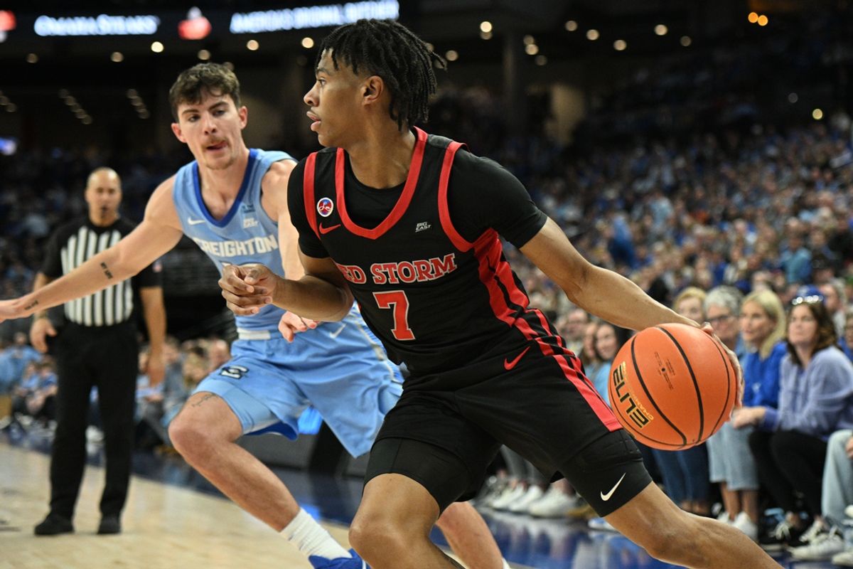 Dec 31, 2024; Omaha, Nebraska, USA;  St. John's Red Storm guard Simeon Wilcher (7) dribbles against Creighton Bluejays forward Mason Miller (13) during the first half at CHI Health Center Omaha. Mandatory Credit: Steven Branscombe-Imagn Images