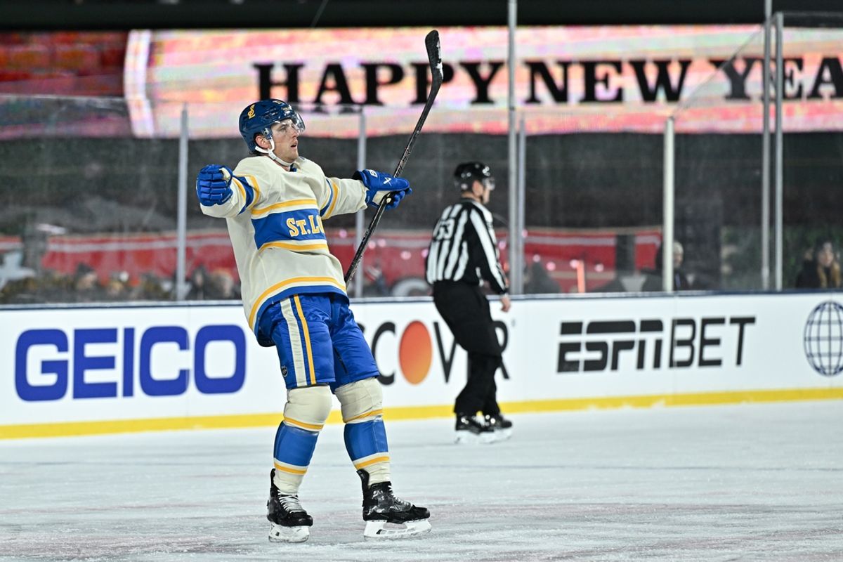 Dec 31, 2024; Chicago, Illinois, USA; St. Louis Blues defenseman Cam Fowler (17) celebrates after his goal against the Chicago Blackhawks during the second period in the Winter Classic at Wrigley Field. Mandatory Credit: Daniel Bartel-Imagn Images