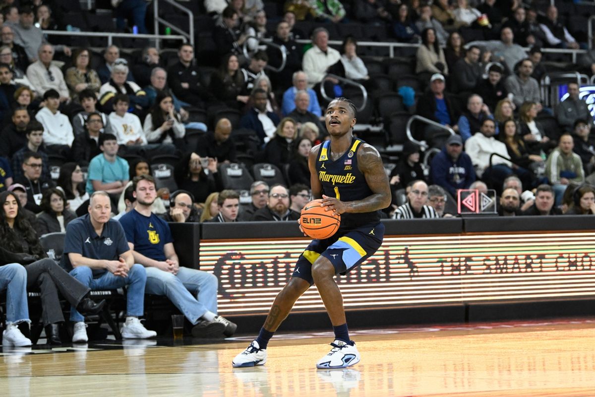 Dec 31, 2024; Providence, Rhode Island, USA; Marquette Golden Eagles guard Kam Jones (1) shoots the ball for three points  during the second half against the Providence Friars at Amica Mutual Pavilion. Mandatory Credit: Eric Canha-Imagn Images