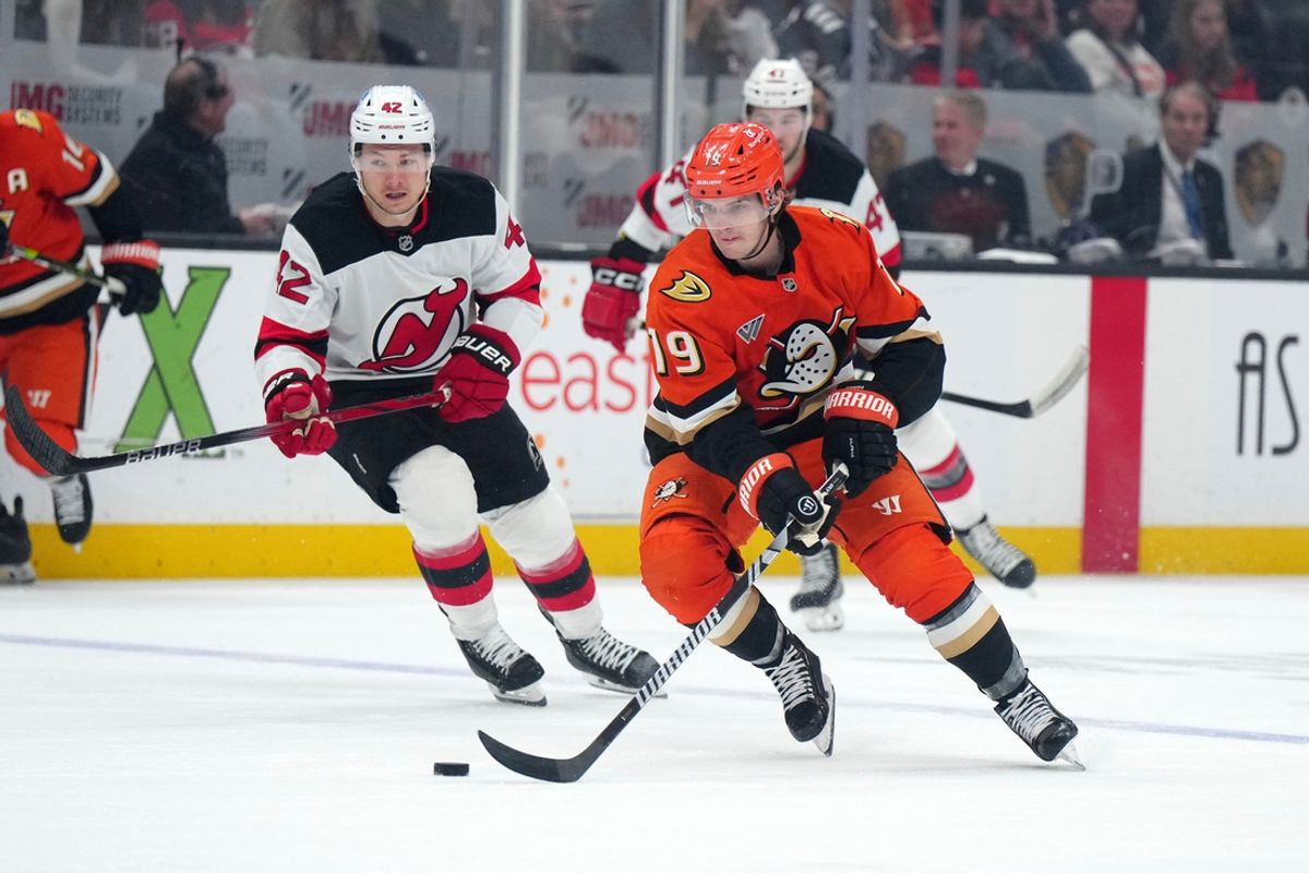 Dec 31, 2024; Anaheim, California, USA; Anaheim Ducks right wing Troy Terry (19) skates with the puck against the New Jersey Devils in the first period at Honda Center. Mandatory Credit: Kirby Lee-Imagn Images