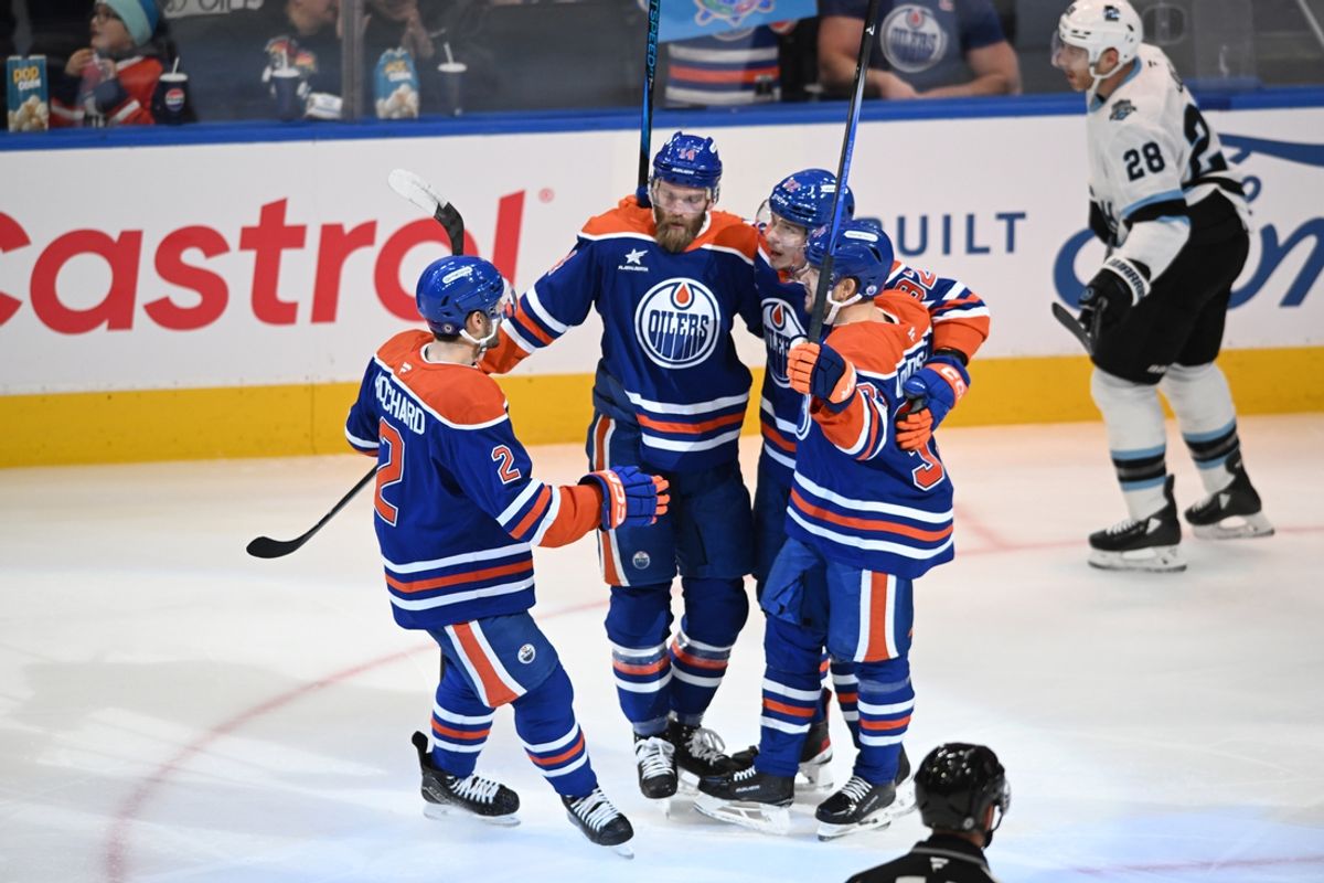 Dec 31, 2024; Edmonton, Alberta, CAN;  Edmonton Oilers defenceman Evan Bouchard (2) celebrates with defenceman Mattias Ekholm (14) and right winger Vasily Podkllxin (92) and left winger Viktor Arvidsson (33) after a goal during the first period against Utah Hockey Club at Rogers Place. Mandatory Credit: Walter Tychnowicz-Imagn Images