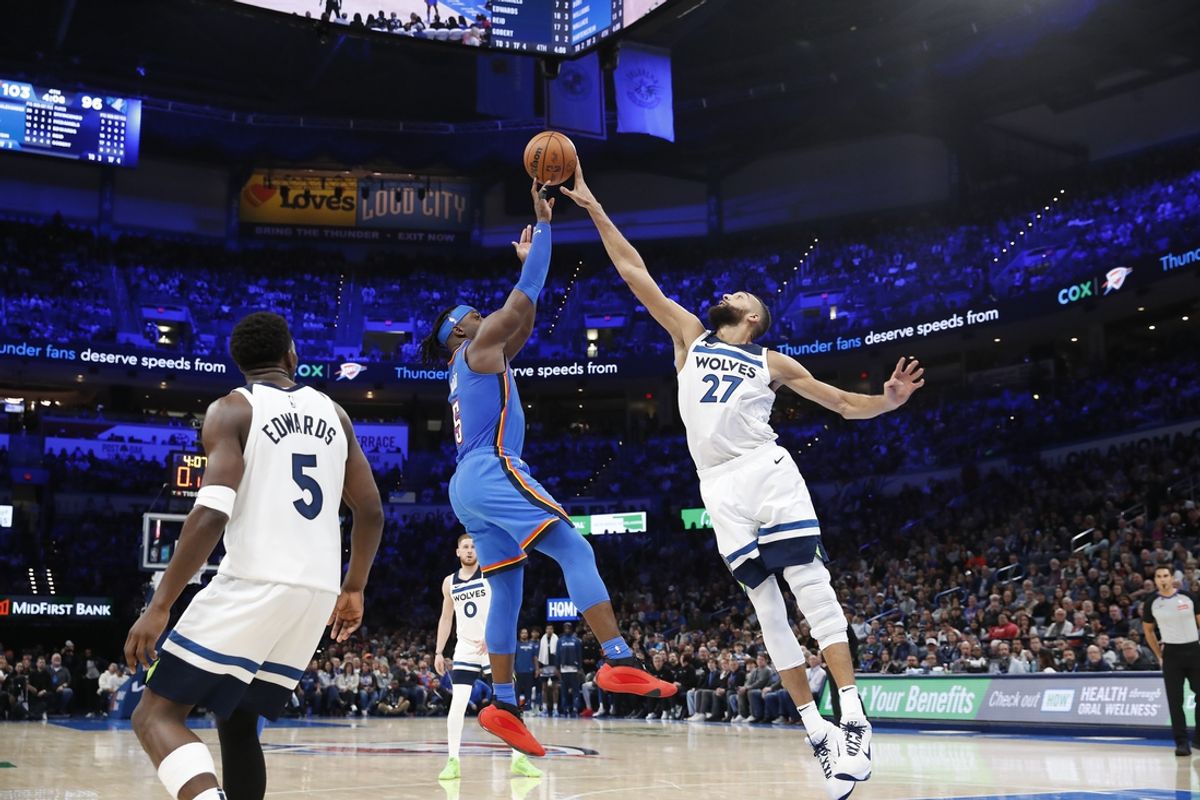 Dec 31, 2024; Oklahoma City, Oklahoma, USA; Minnesota Timberwolves center Rudy Gobert (27) blocks a shot by Oklahoma City Thunder guard Luguentz Dort (5) during the second half at Paycom Center. Mandatory Credit: Alonzo Adams-Imagn Images