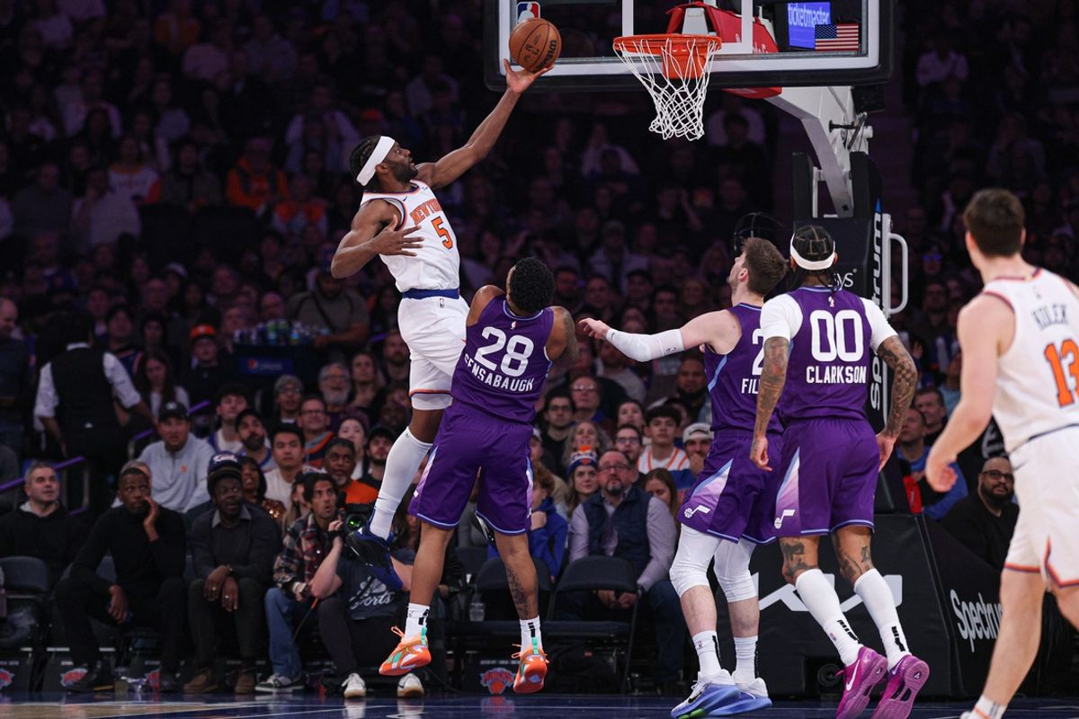 Jan 1, 2025; New York, New York, USA; New York Knicks forward Precious Achiuwa (5) goes to the basket asUtah Jazz forward Brice Sensabaugh (28) defends during the first half at Madison Square Garden. Mandatory Credit: Vincent Carchietta-Imagn Images