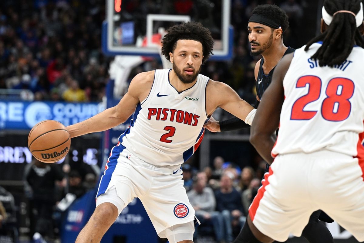 Jan 1, 2025; Detroit, Michigan, USA;  Detroit Pistons guard Cade Cunningham (2) takes the ball up court against the Orlando Magic in the fourth quarter at Little Caesars Arena. Mandatory Credit: Lon Horwedel-Imagn Images