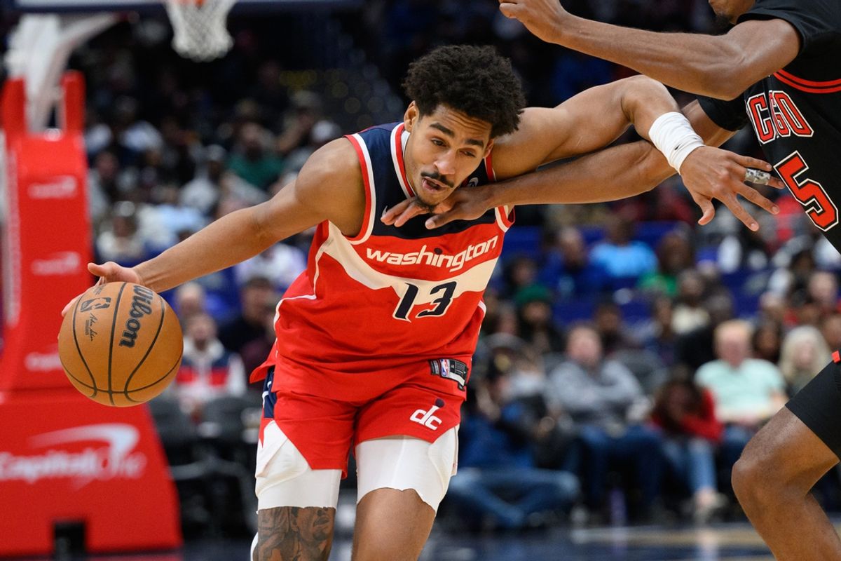 Jan 1, 2025; Washington, District of Columbia, USA; Washington Wizards guard Jordan Poole (13) drives to the basket against Chicago Bulls forward Dalen Terry (25) during the second quarter at Capital One Arena. Mandatory Credit: Reggie Hildred-Imagn Images