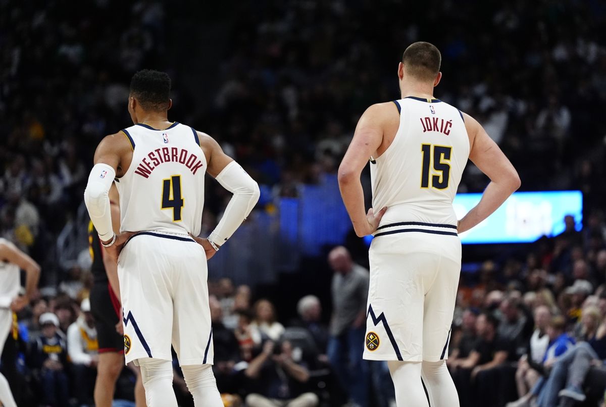 Jan 1, 2025; Denver, Colorado, USA; Denver Nuggets guard Russell Westbrook (4) and center Nikola Jokic (15) during the third quarter against the Atlanta Hawks at Ball Arena. Mandatory Credit: Ron Chenoy-Imagn Images