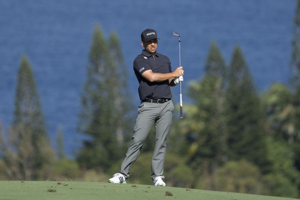 January 2, 2025; Maui, Hawaii, USA; Xander Schauffele hits his fairway shot on the fourth hole during the first round of The Sentry golf tournament at Plantation Course at Kapalua. Mandatory Credit: Kyle Terada-Imagn Images