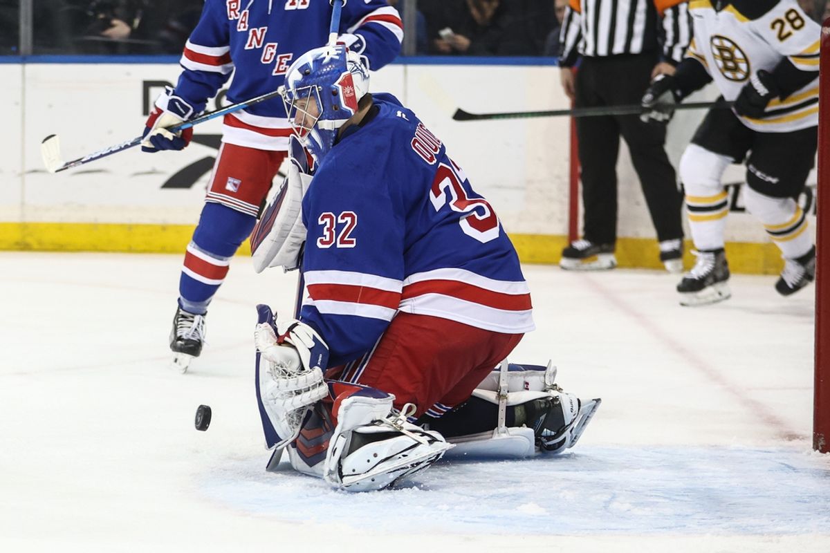 Jan 2, 2025; New York, New York, USA;  New York Rangers goaltender Jonathan Quick (32) makes a save on a shot on goal attempt in the first period against the Boston Bruins at Madison Square Garden. Mandatory Credit: Wendell Cruz-Imagn Images