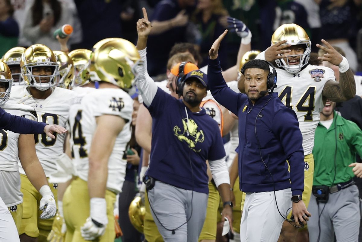 Jan 2, 2025; New Orleans, LA, USA; Notre Dame Fighting Irish head coach Marcus Freeman celebrates on the sidelines in the final minute against the Georgia Bulldogs during the fourth quarter at Caesars Superdome. Mandatory Credit: Geoff Burke-Imagn Images