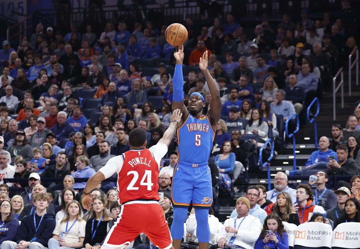 Jan 2, 2025; Oklahoma City, Oklahoma, USA; Oklahoma City Thunder guard Luguentz Dort (5) shoots a three point basket over Los Angeles Clippers guard Norman Powell (24) during the second quarter at Paycom Center. Mandatory Credit: Alonzo Adams-Imagn Images