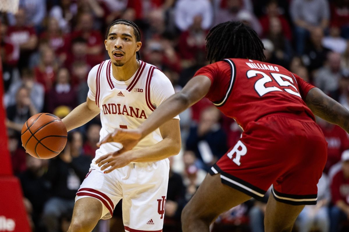 Jan 2, 2025; Bloomington, Indiana, USA; Indiana Hoosiers guard Myles Rice (1) dribbles the ball while Rutgers Scarlet Knights guard Jeremiah Williams (25) defends in the first half at Simon Skjodt Assembly Hall. Mandatory Credit: Trevor Ruszkowski-Imagn Images