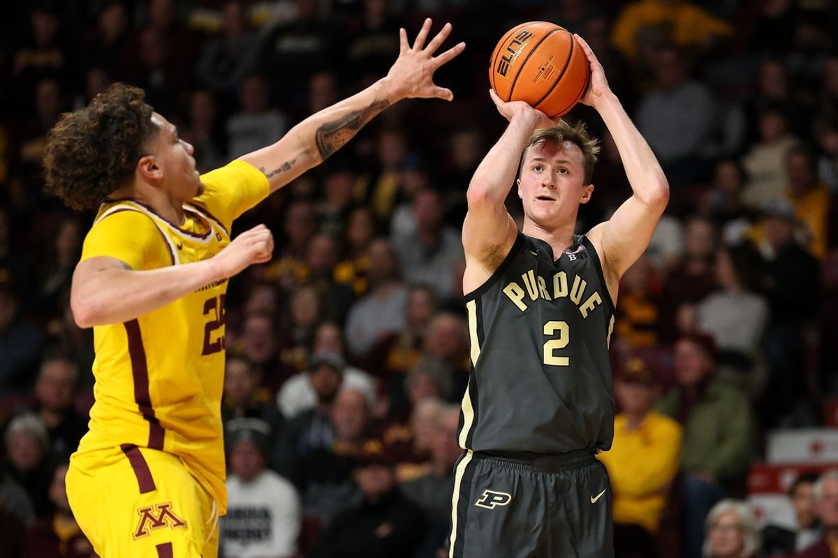 Jan 2, 2025; Minneapolis, Minnesota, USA; Purdue Boilermakers guard Fletcher Loyer (2) shoots as Minnesota Golden Gophers guard Lu'Cye Patterson (25) defends during the second half at Williams Arena. Mandatory Credit: Matt Krohn-Imagn Images