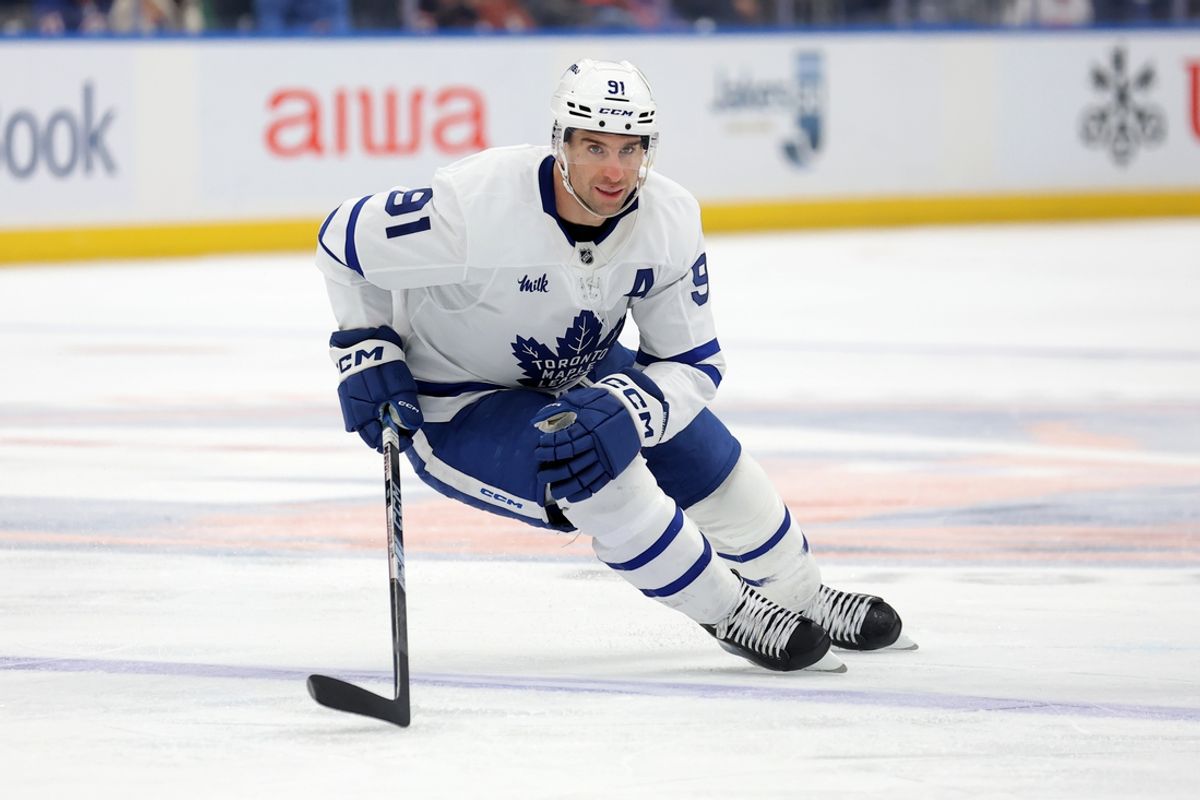 Jan 2, 2025; Elmont, New York, USA; Toronto Maple Leafs center John Tavares (91) skates against the New York Islanders during the third period at UBS Arena. Mandatory Credit: Brad Penner-Imagn Images