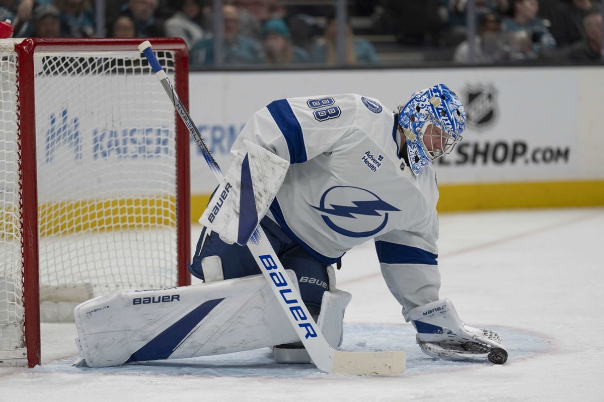 Jan 2, 2025; San Jose, California, USA;  Tampa Bay Lightning goaltender Andrei Vasilevskiy (88) stops the puck during the second period against the San Jose Sharks at SAP Center at San Jose. Mandatory Credit: Stan Szeto-Imagn Images