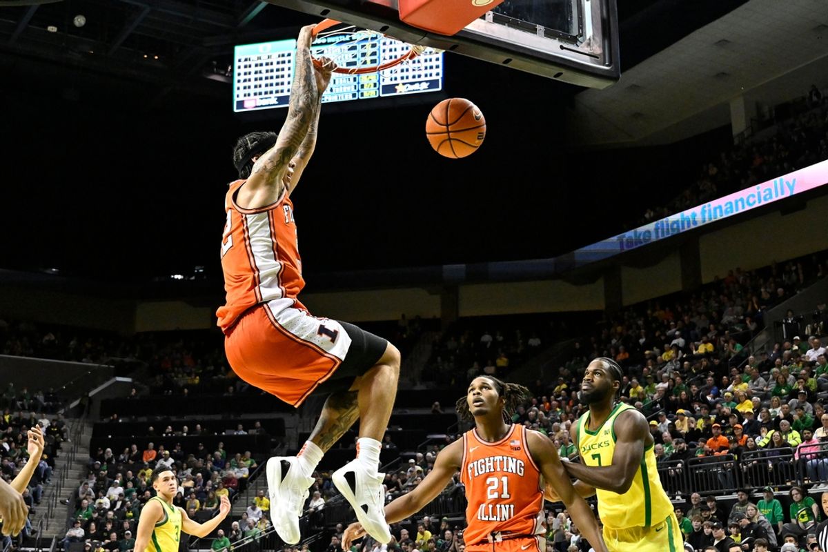 Jan 2, 2025; Eugene, Oregon, USA; Illinois Fighting Illini guard Tre White (22) dunks the ball against the Oregon Ducks during the second half at Matthew Knight Arena. Mandatory Credit: Craig Strobeck-Imagn Images