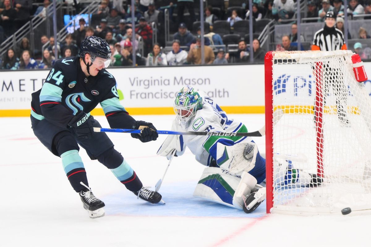 Jan 2, 2025; Seattle, Washington, USA; Seattle Kraken right wing Kaapo Kakko (84) misses a goal shot with Vancouver Canucks goaltender Kevin Lankinen (32) in goal during the shootout at Climate Pledge Arena. Mandatory Credit: Steven Bisig-Imagn Images