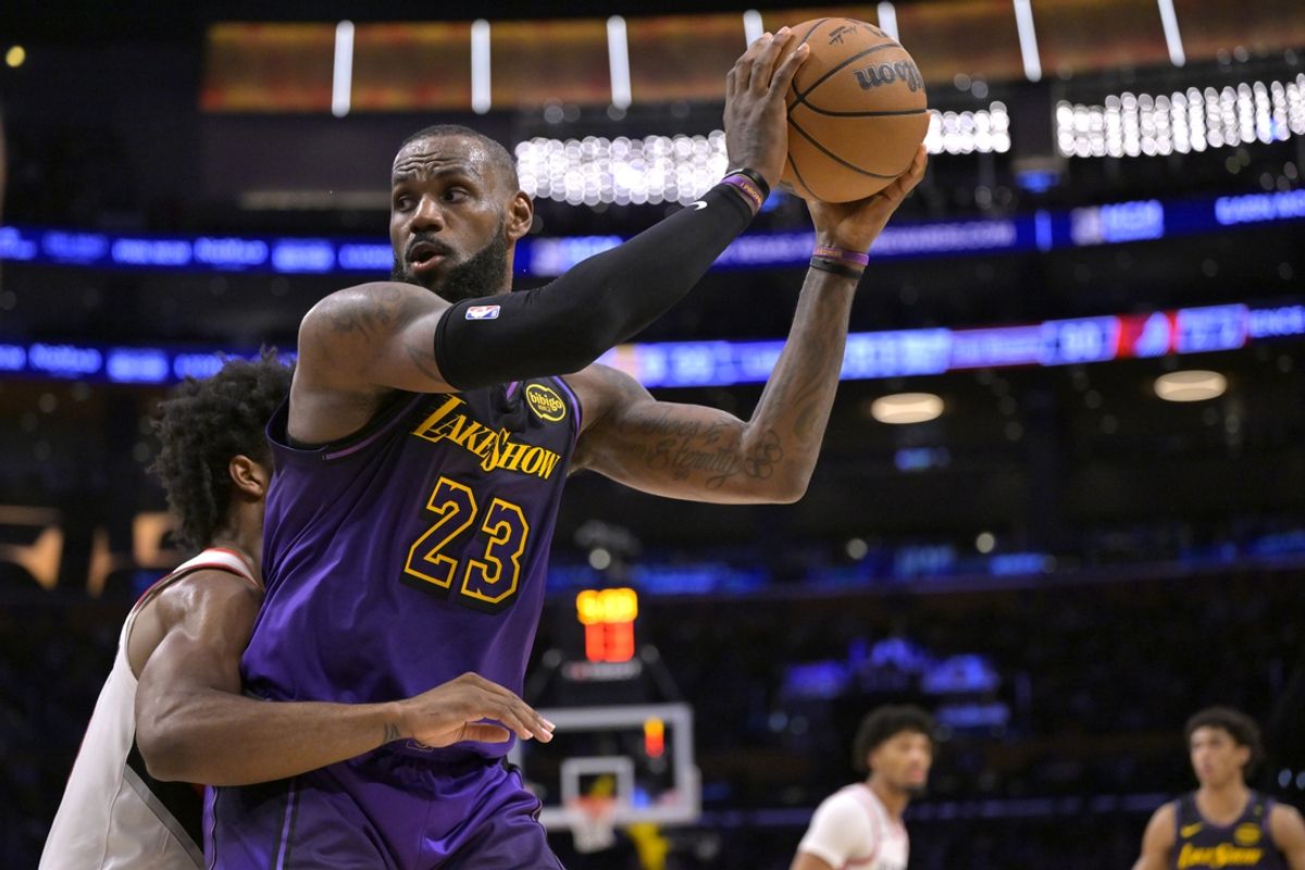 Jan 2, 2025; Los Angeles, California, USA;  Portland Trail Blazers guard Scoot Henderson (00) defends Los Angeles Lakers forward LeBron James (23) in the second half at Crypto.com Arena. Mandatory Credit: Jayne Kamin-Oncea-Imagn Images