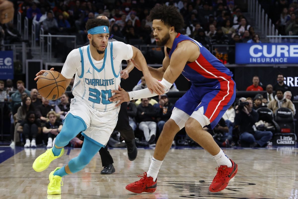Jan 3, 2025; Detroit, Michigan, USA;  Charlotte Hornets guard Seth Curry (30) dribbles defended by Detroit Pistons guard Cade Cunningham (2) in the first half at Little Caesars Arena. Mandatory Credit: Rick Osentoski-Imagn Images