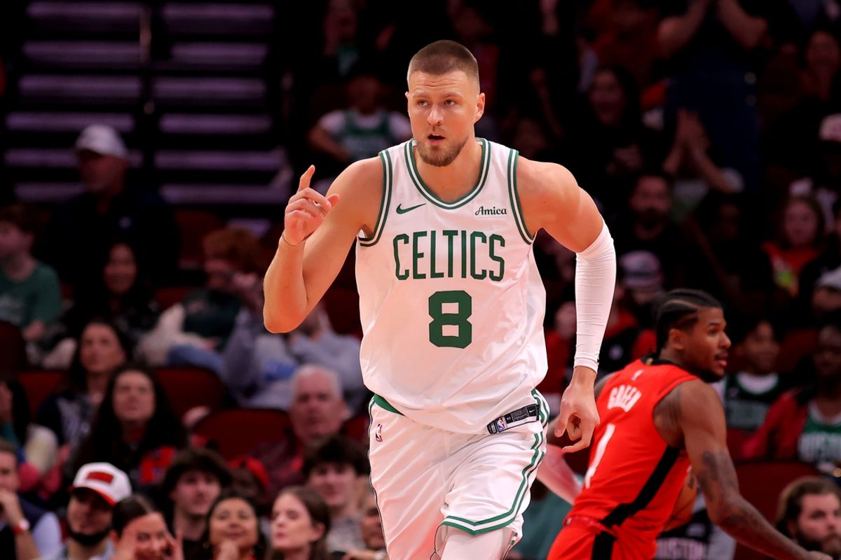 Jan 3, 2025; Houston, Texas, USA; Boston Celtics center Kristaps Porzingis (8) reacts after a dunk against the Houston Rockets during the first quarter at Toyota Center. Mandatory Credit: Erik Williams-Imagn Images