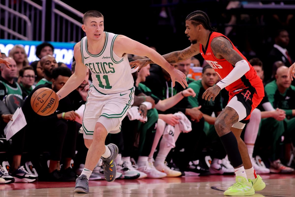 Jan 3, 2025; Houston, Texas, USA; Boston Celtics guard Payton Pritchard (11) handles the ball against Houston Rockets guard Jalen Green (4) during the first quarter at Toyota Center. Mandatory Credit: Erik Williams-Imagn Images