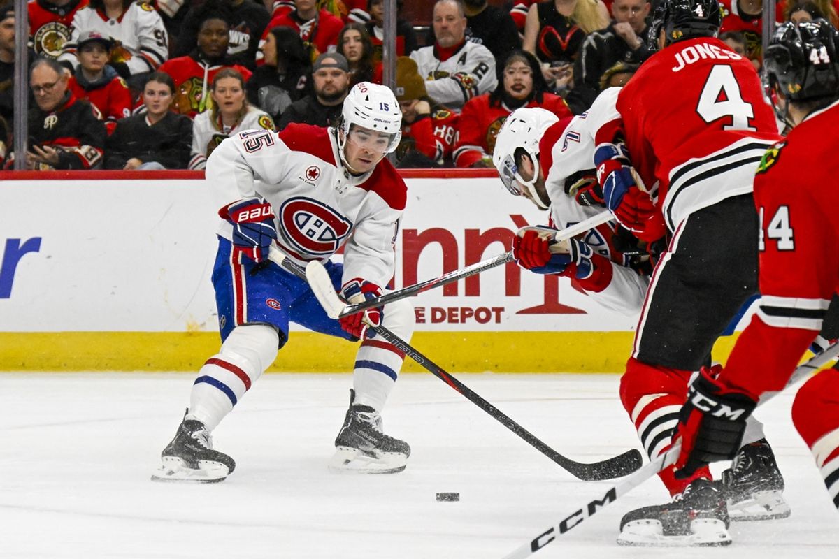 Jan 3, 2025; Chicago, Illinois, USA;  Montreal Canadiens center Alex Newhook (15) moves the puck against the Chicago Blackhawks during the first period at United Center. Mandatory Credit: Matt Marton-Imagn Images