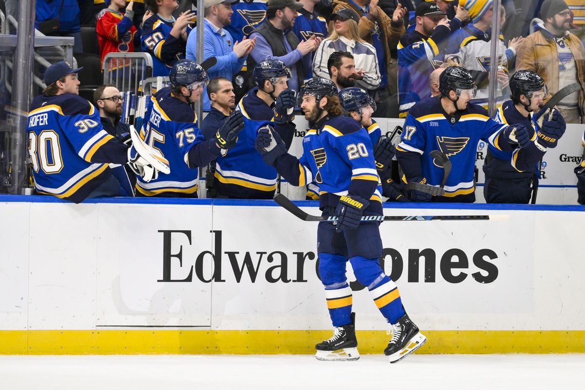 Jan 3, 2025; St. Louis, Missouri, USA;  St. Louis Blues left wing Brandon Saad (20) is congratulated by teammates after scoring against the Ottawa Senators during the first period at Enterprise Center. Mandatory Credit: Jeff Curry-Imagn Images
