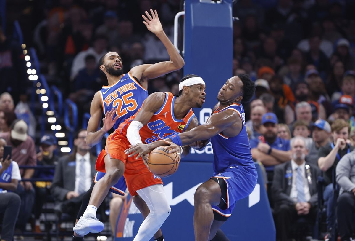 Jan 3, 2025; Oklahoma City, Oklahoma, USA; New York Knicks forward OG Anunoby (8) defends a drive by Oklahoma City Thunder guard Shai Gilgeous-Alexander (2) during the second quarter at Paycom Center. Mandatory Credit: Alonzo Adams-Imagn Images
