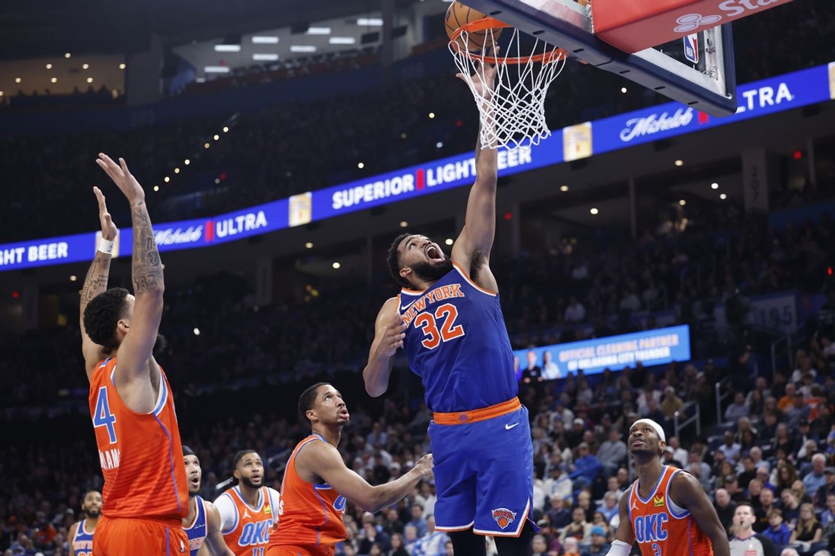 Jan 3, 2025; Oklahoma City, Oklahoma, USA;New York Knicks center Karl-Anthony Towns (32) shoots against the Oklahoma City Thunder during the second quarter at Paycom Center. Mandatory Credit: Alonzo Adams-Imagn Images