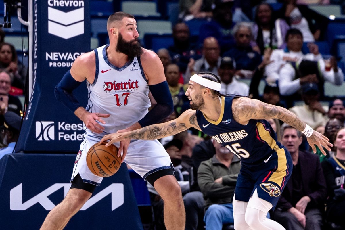 Jan 3, 2025; New Orleans, Louisiana, USA;  New Orleans Pelicans guard Jose Alvarado (15) knocks the ball from Washington Wizards center Jonas Valanciunas (17) during the first half at Smoothie King Center. Mandatory Credit: Stephen Lew-Imagn Images