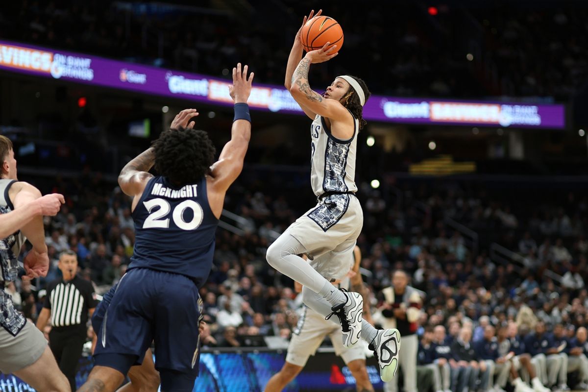 Jan 3, 2025; Washington, District of Columbia, USA; Georgetown Hoyas guard Malik Mack (2) shoots over Xavier Musketeers guard Dayvion McKnight (20) during the first half at Capital One Arena. Mandatory Credit: Daniel Kucin Jr.-Imagn Images