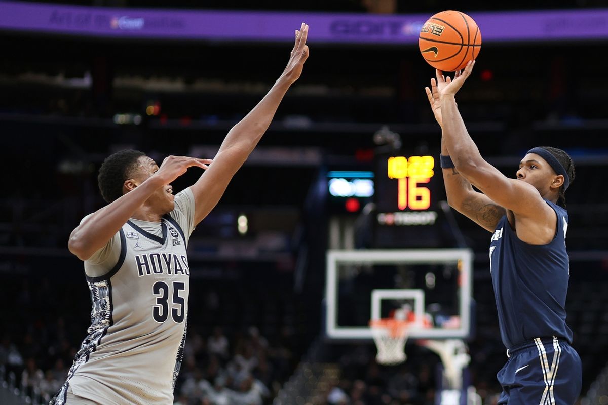 Jan 3, 2025; Washington, District of Columbia, USA; Xavier Musketeers guard Ryan Conwell (7) takes a shot over Georgetown Hoyas forward Thomas Sorber (35) during the second half at Capital One Arena. Mandatory Credit: Daniel Kucin Jr.-Imagn Images
