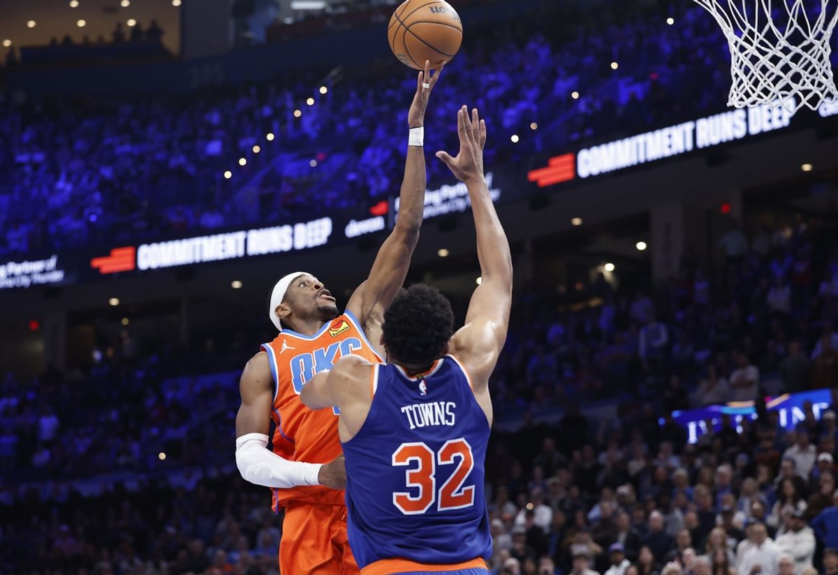 Jan 3, 2025; Oklahoma City, Oklahoma, USA; Oklahoma City Thunder guard Shai Gilgeous-Alexander (2) shoots as New York Knicks center Karl-Anthony Towns (32) defends during the second half at Paycom Center. Mandatory Credit: Alonzo Adams-Imagn Images