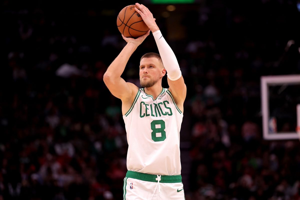 Jan 3, 2025; Houston, Texas, USA; Boston Celtics center Kristaps Porzingis (8) shoots outside against the Houston Rockets during the fourth quarter at Toyota Center. Mandatory Credit: Erik Williams-Imagn Images