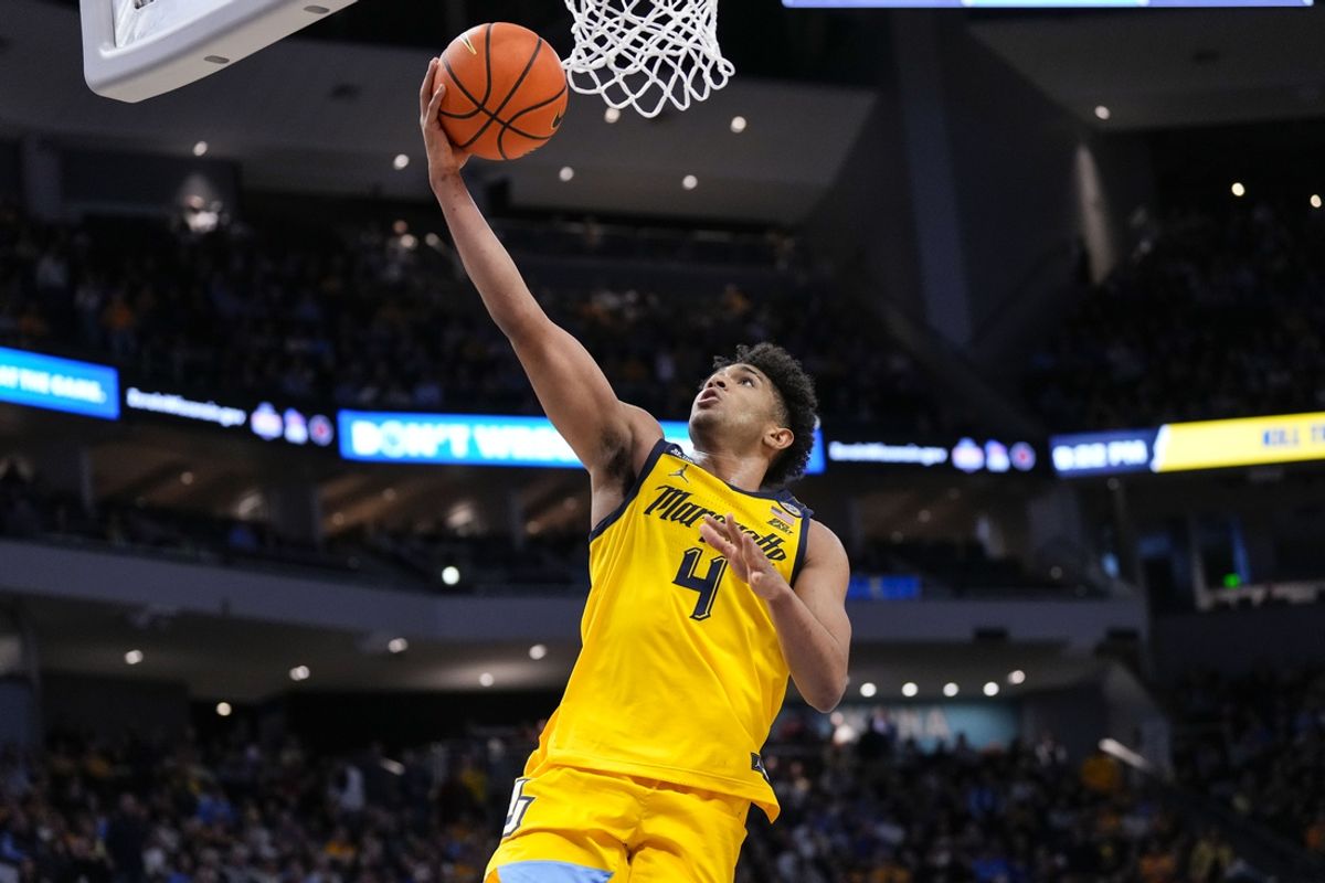 Jan 3, 2025; Milwaukee, Wisconsin, USA;  Marquette Golden Eagles guard Stevie Mitchell (4) shoots during the second half against the Creighton Bluejays at Fiserv Forum. Mandatory Credit: Jeff Hanisch-Imagn Images