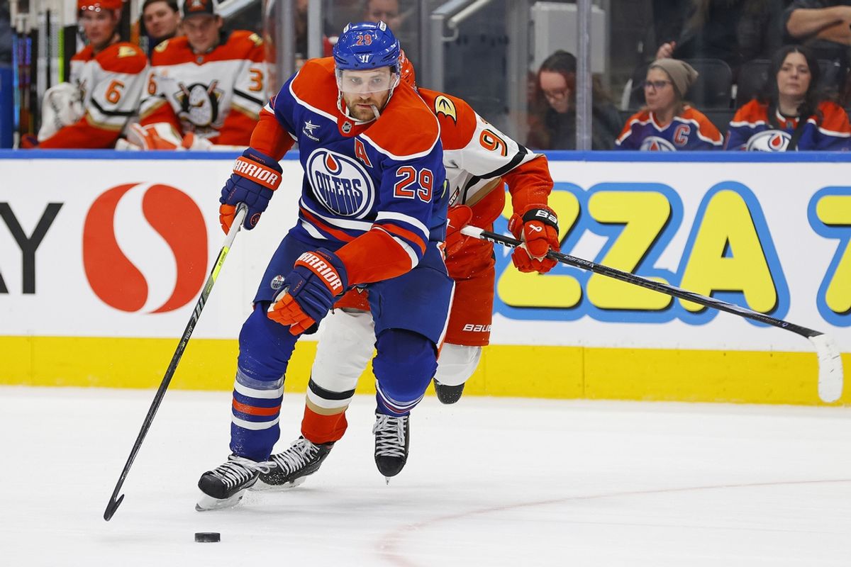 Jan 3, 2025; Edmonton, Alberta, CAN; Edmonton Oilers forward Leon Draisaitl (29) looks to make a play in front of forward Leo Carlsson (91) during the third period at Rogers Place. Mandatory Credit: Perry Nelson-Imagn Images