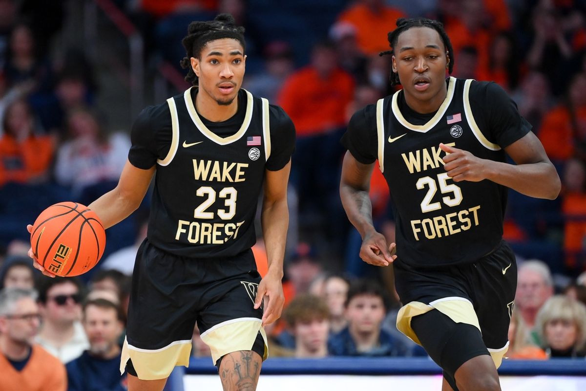 Dec 31, 2024; Syracuse, New York, USA; Wake Forest Demon Deacons guard Hunter Sallis (23) dribbles with teammate forward Tre'Von Spillers (25) during the second half against the Syracuse Orange at the JMA Wireless Dome. Mandatory Credit: Rich Barnes-Imagn Images