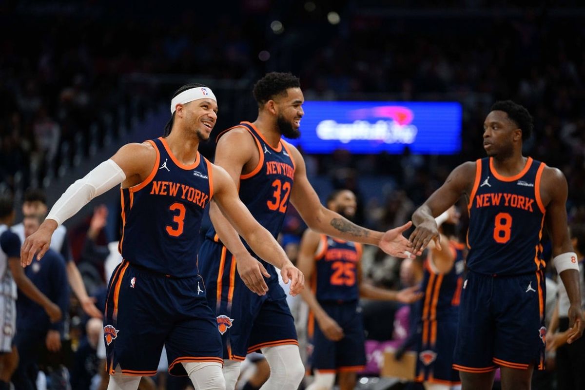 Dec 30, 2024; Washington, District of Columbia, USA; New York Knicks center Karl-Anthony Towns (32) reacts with guard Josh Hart (3), and forward OG Anunoby (8) after a field goal during the fourth quarter against the Washington Wizards at Capital One Arena. Mandatory Credit: Reggie Hildred-Imagn Images