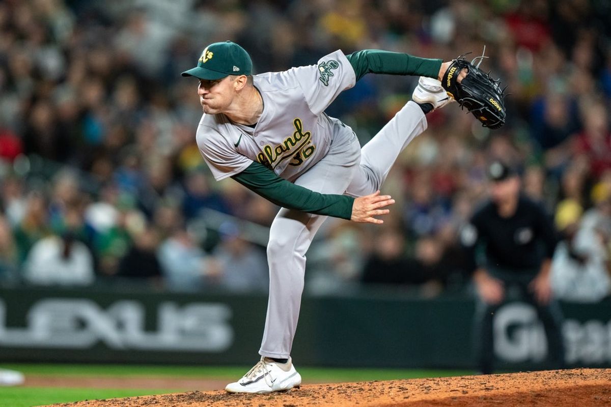 Sep 28, 2024; Seattle, Washington, USA;  Oakland Athletics reliever Ross Stripling (36) delivers a pitch against the Seattle Mariners at T-Mobile Park. Mandatory Credit: Stephen Brashear-Imagn Images