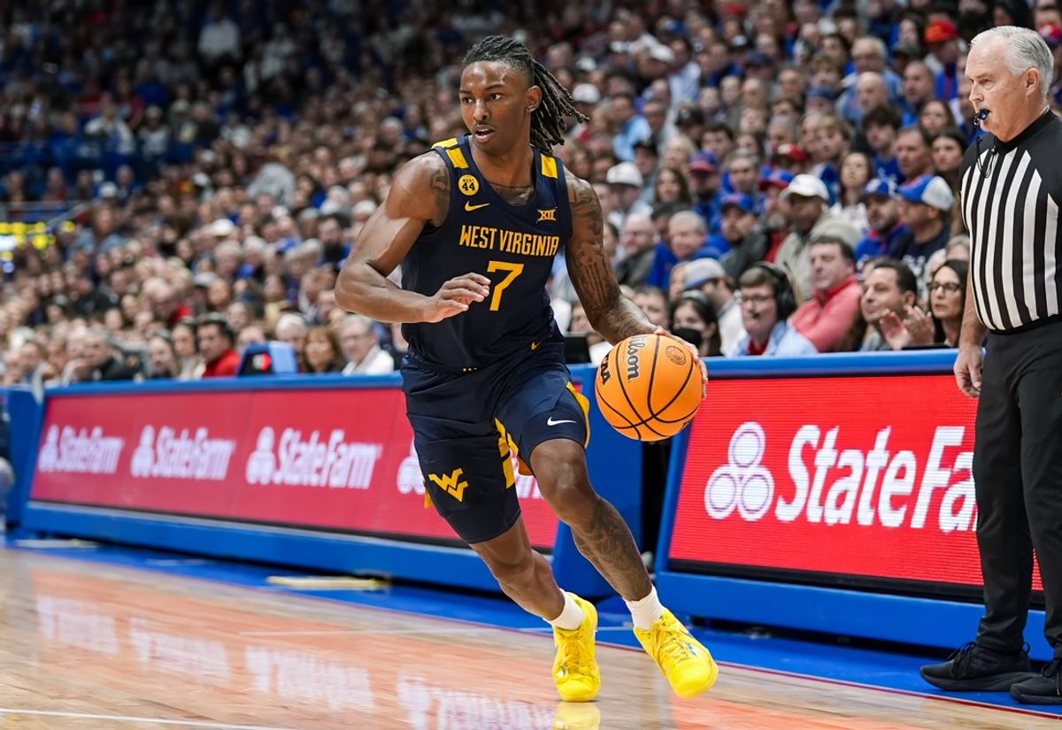 Dec 31, 2024; Lawrence, Kansas, USA; West Virginia Mountaineers guard Javon Small (7) dribbles the ball during the first half against the Kansas Jayhawks at Allen Fieldhouse. Mandatory Credit: Jay Biggerstaff-Imagn Images