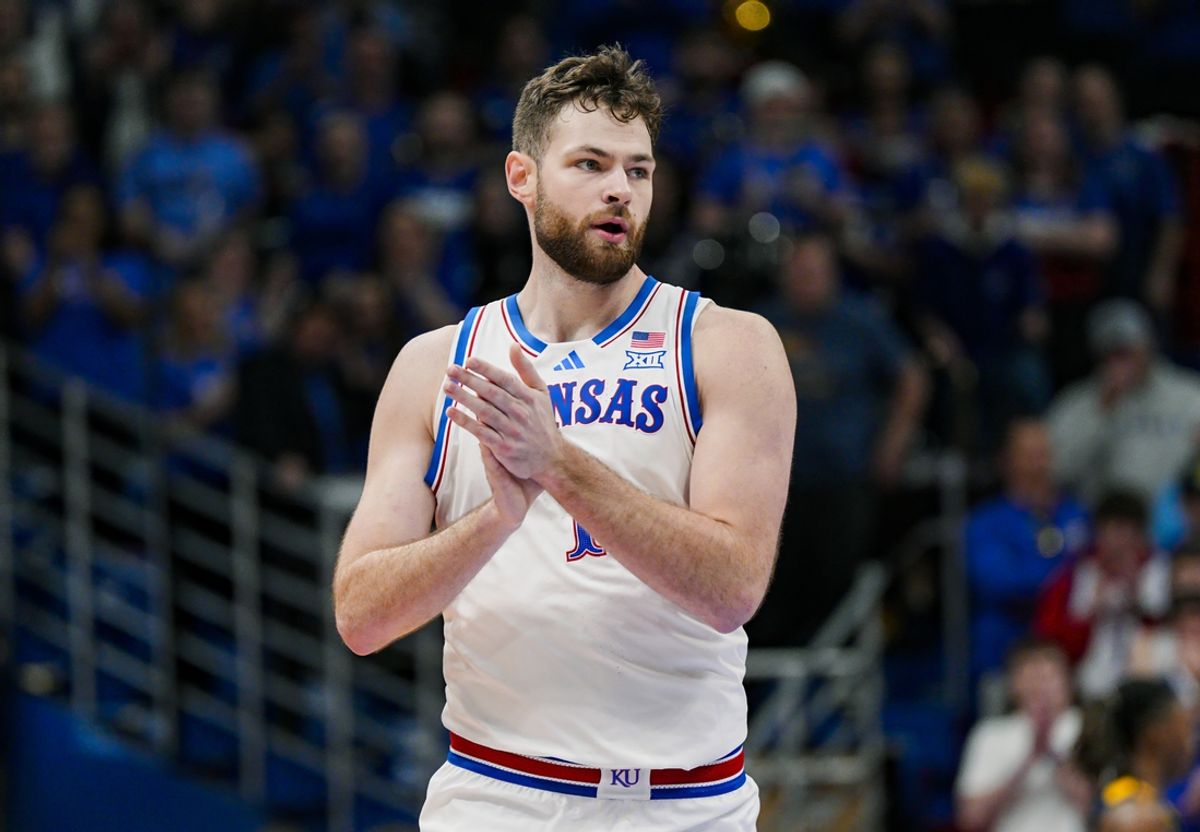 Dec 31, 2024; Lawrence, Kansas, USA; Kansas Jayhawks center Hunter Dickinson (1) reacts during the first half against the West Virginia Mountaineers at Allen Fieldhouse. Mandatory Credit: Jay Biggerstaff-Imagn Images
