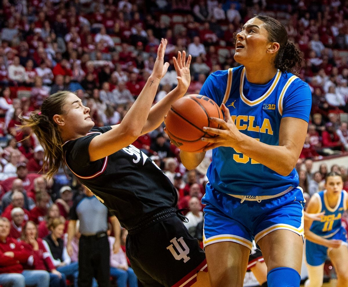 UCLA's Lauren Betts (51) shoots over Indiana's Lilly Meister (52) during the Indiana versus UCLA women's game at Simon Skjodt Assembly Hall on Saturday, Jan. 4, 2025.