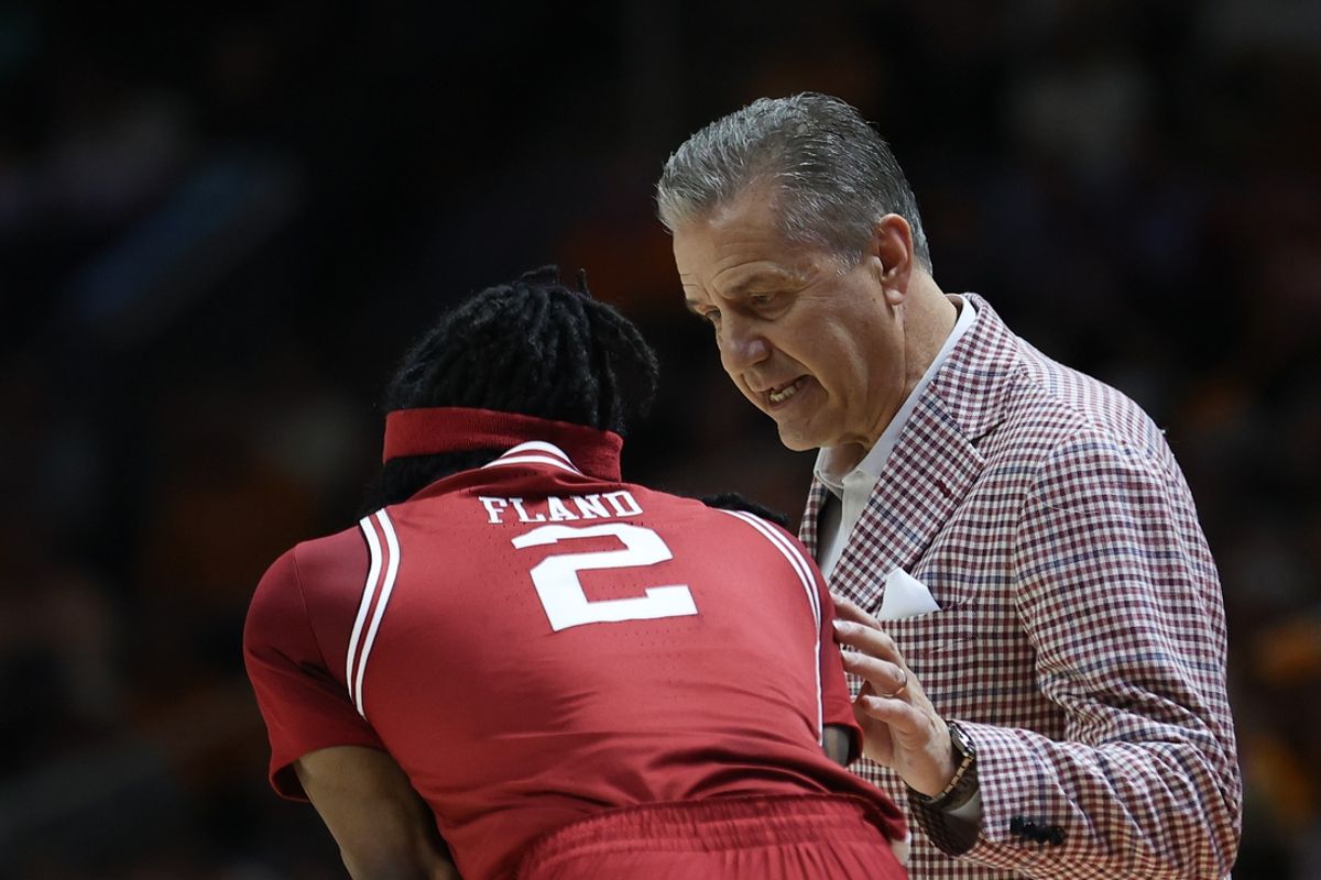 Jan 4, 2025; Knoxville, Tennessee, USA; Arkansas Razorbacks head coach John Calipari speaks with guard Boogie Fland (2) during the first half against the Tennessee Volunteers at Thompson-Boling Arena at Food City Center. Mandatory Credit: Randy Sartin-Imagn Images