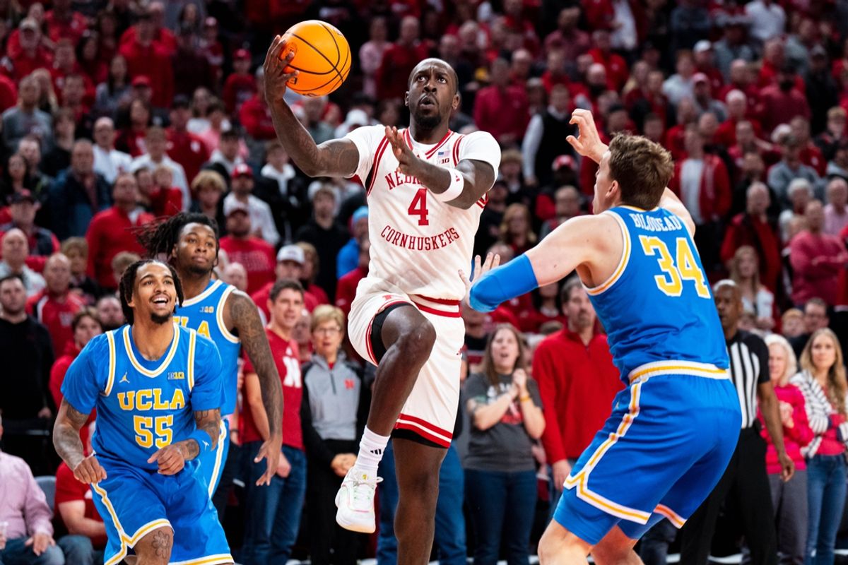 Jan 4, 2025; Lincoln, Nebraska, USA; Nebraska Cornhuskers forward Juwan Gary (4) shoots the ball against UCLA Bruins forward Tyler Bilodeau (34) during the first half at Pinnacle Bank Arena. Mandatory Credit: Dylan Widger-Imagn Images