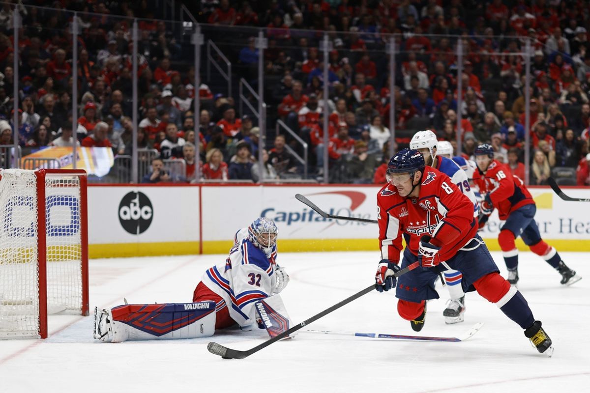 Jan 4, 2025; Washington, District of Columbia, USA; Washington Capitals left wing Alex Ovechkin (8) scores a goal on New York Rangers goaltender Jonathan Quick (32) in the third period at Capital One Arena. Mandatory Credit: Geoff Burke-Imagn Images
