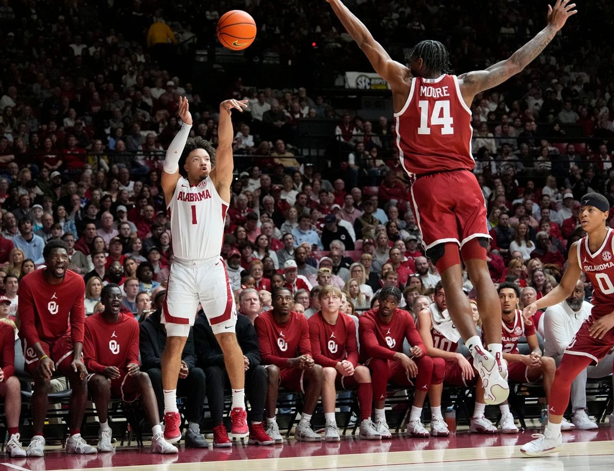 Jan 4, 2025; Tuscaloosa, AL, USA; Alabama guard Mark Sears (1) takes a three point shot with Oklahoma forward Jalon Moore (14) defending at Coleman Coliseum. Mandatory Credit: Gary Cosby Jr.-Tuscaloosa News