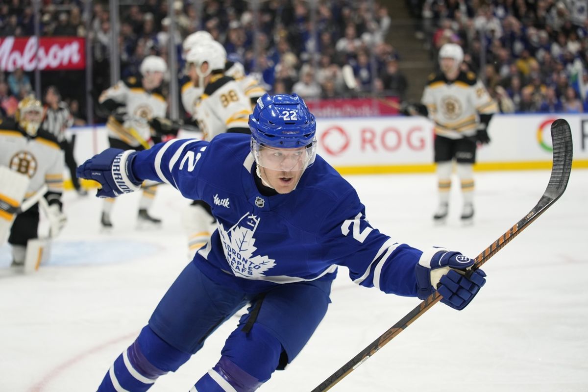 Jan 4, 2025; Toronto, Ontario, CAN; Toronto Maple Leafs defenceman Jake McCabe (22) reacts after scoring against the Boston Bruins during the first period at Scotiabank Arena. Mandatory Credit: John E. Sokolowski-Imagn Images